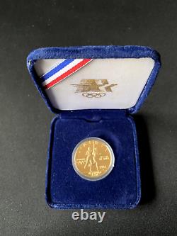 1984 W 10 $ Pièce Commémorative D'or Olympique