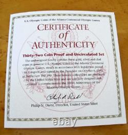 Ensemble commémoratif de 32 pièces en or et en argent des Jeux Olympiques d'Atlanta 1995-1996, avec boîte en bois et clé.