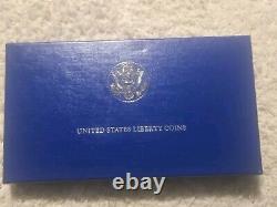 Ensemble de pièces Liberty des États-Unis de 1986 - Pièce en or de 5 $, pièce en argent de 1 $ et pièce en argent de 0,5 $ avec certificat d'authenticité et boîte