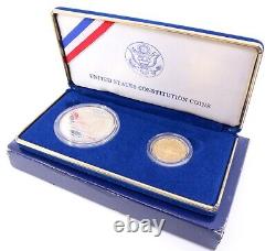 Ensemble de pièces de monnaie de preuve du dollar en argent de la constitution américaine de 1987 et du dollar en or de cinq dollars.