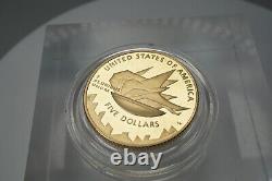 Les Jeux olympiques de Salt Lake City en 2002 - Pièce commémorative en or 21K de cinq dollars à l'épreuve.