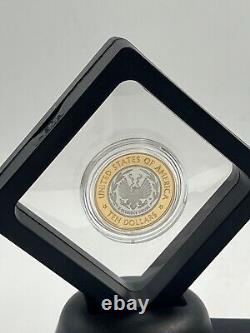 Pièce bi-métallique en or et platine de la bibliothèque du Congrès de 10 $ de 2000-W, avec boîte, sans certificat d'authenticité.