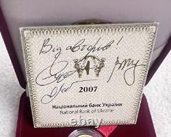 Pièce en or commémorative Libra dans un écrin. Certificat avec 3 signatures